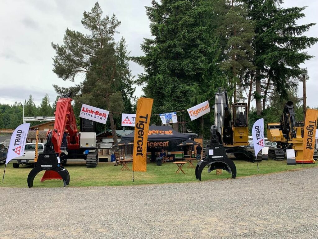 Timber loader equipment from Link-Belt and Tigercat brands as part of an exhibition by Triad Machinery at the Deming Logging Show.